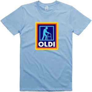 May include: Light blue t-shirt with a rainbow-colored square graphic featuring a blue silhouette of a person walking with a walker and the word "OLDI" in yellow letters.