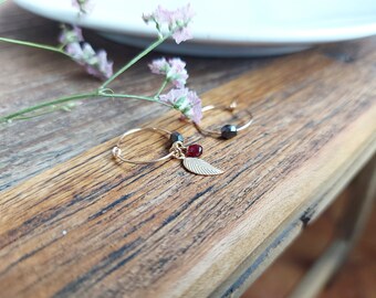 FLORA. 14k gold filled earrings with leaf-shaped pendant and faceted bohemian glass beads