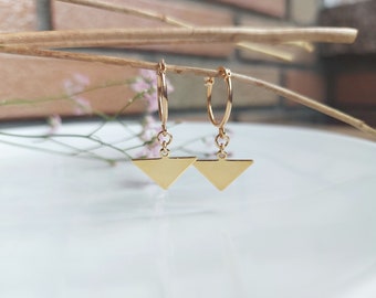 TRIANGULUM. 3 micron gold plated hoop earrings with triangle shaped pendants.