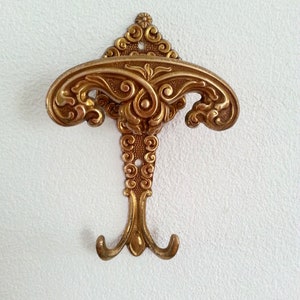 Vintage,  coat / hat hook with Victorian decoration.