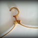 Stylish vintage brass clothes hanger, with vintage patina.