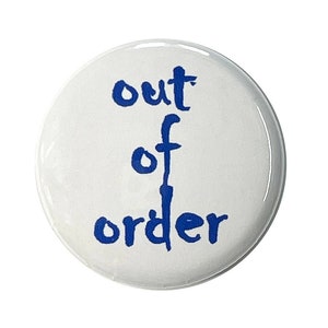 May include: White button with blue text that reads "out of order".