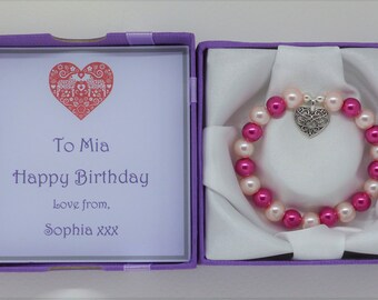 Personalised name bracelet gifts for girls. Heart charm. Box & message card. Birthday party gift. Pink, blue, lilac, rainbow colours.