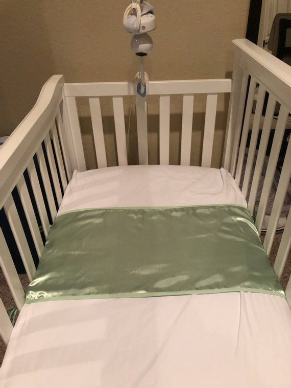 crib sheet on back seat of car