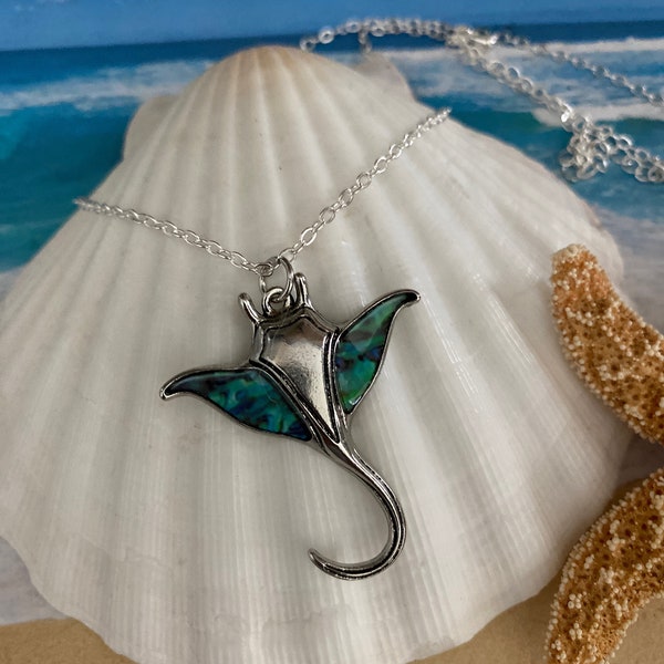 Manta Ray of silver and teal blue stone on a silver-plated chain, (adjusts to 16, 17 and 18 inches or shiney black Korean wax cord