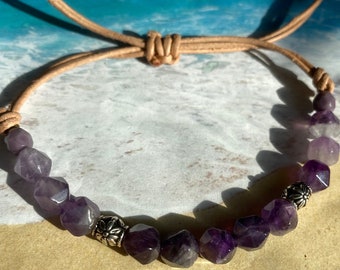 Amethyst gem stone beads on leather cord with accent metal beads. Pull cords to secure bracelet