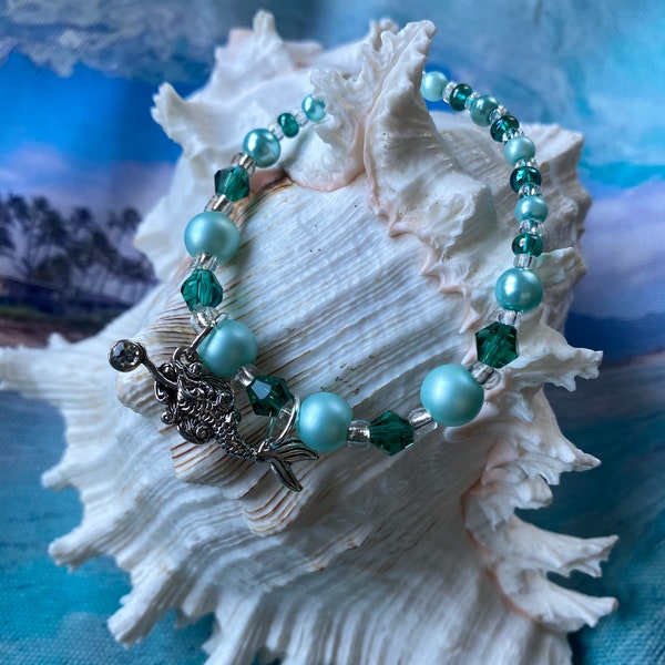 Mermaid bracelet and ring for young girls (5.5 inch). Stretchy band with glass teal-colored pearls and sea green crystals.