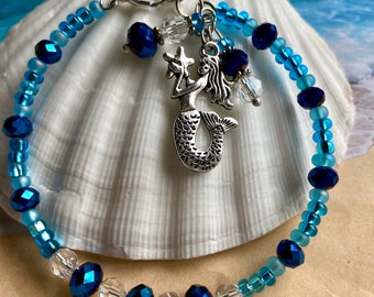 Blue crystal and glass beaded memory wire bracelet and dangles of choice of charm and crystal and glass beads 7.3 inch plus1 inch extension