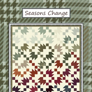 May include: A quilt pattern titled "Seasons Change" by Coach House Designs. The quilt features a repeating leaf pattern in shades of green, brown, red, and blue on a cream background. The quilt is framed by a green and brown houndstooth pattern.