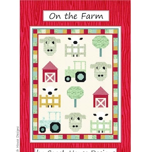 May include: A quilt pattern called "On the Farm" by Coach House Designs. The pattern features a white background with red barns, green trees, blue tractors, and white sheep.