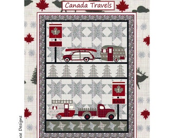 May include: A quilt pattern featuring a red, white, and blue Canadian flag, a red truck, a red station wagon, and a red camper. The quilt is set against a background of white stars and gray plaid. The text "Canada Travels" is at the top of the quilt, and the text "by Coach House Designs" is at the bottom.