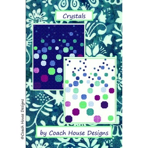 May include: A quilt pattern called "Crystals" by Coach House Designs. The pattern features a design of colourful circles and hexagons on a white and blue background.
