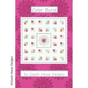 May include: A quilt pattern named "Color Burst" by Coach House Designs. The design showcases a white backdrop with colourful squares and a central floral motif. The background is a vibrant pink with a floral pattern.