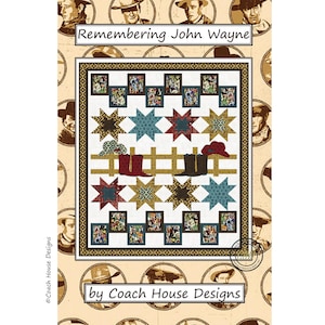 May include: A quilt with a western theme, featuring a central design of stars, cowboy boots, and a hat. The quilt is bordered by a decorative pattern and the text "Remembering John Wayne" is displayed at the top. The quilt is by Coach House Designs.