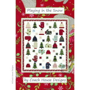 May include: A quilt pattern titled "Playing in the Snow" by Coach House Designs. The design features a white background with colorful mittens, hats, and Christmas trees. The border is red with snowflakes and floral accents.
