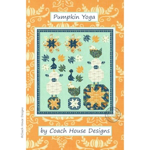 May include: A quilt pattern titled "Pumpkin Yoga" with a light blue center featuring various shapes and patterns. The quilt has a border of orange and white pumpkins and leaves. The text "by Coach House Designs" is also visible.