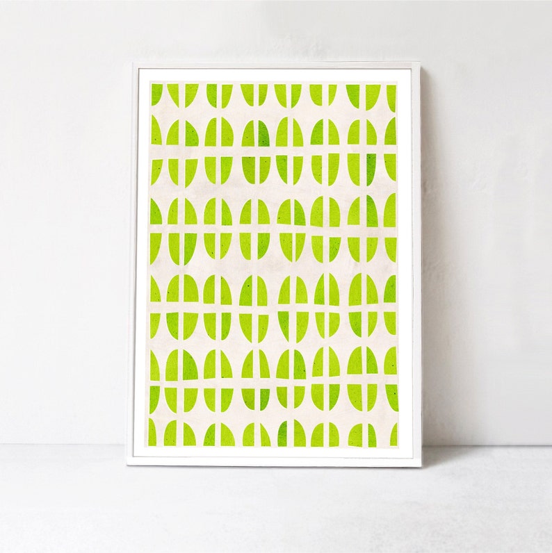 May include: A framed print with a geometric pattern of green circles and semi-circles on a white background.
