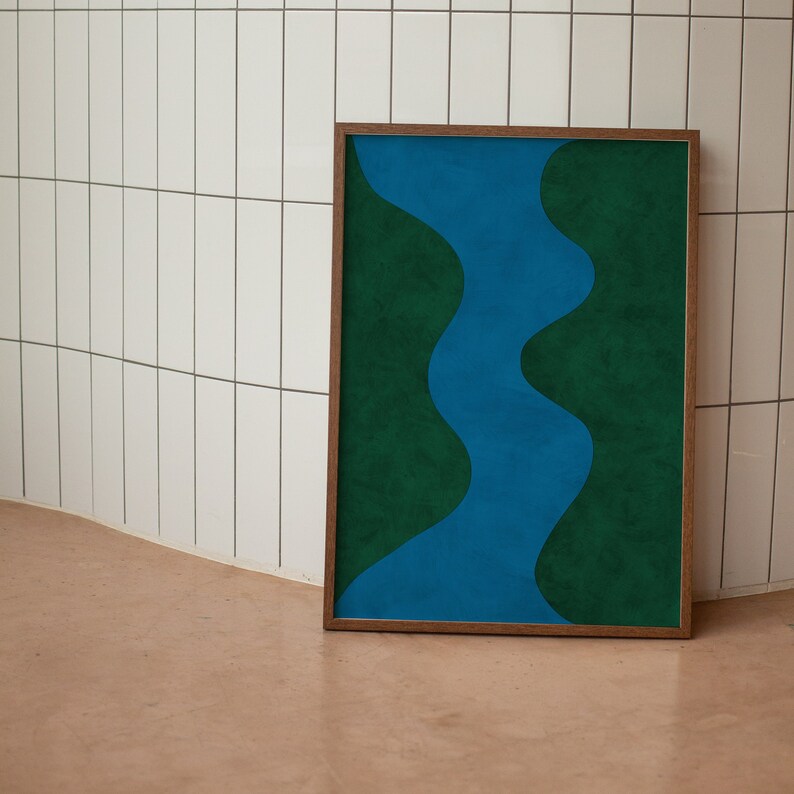 May include: A framed abstract art print with a blue wavy line design on a green background.