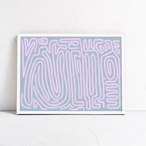 May include: Abstract art print with a white frame. The print features a light blue background with a pink abstract pattern of lines and swirls.