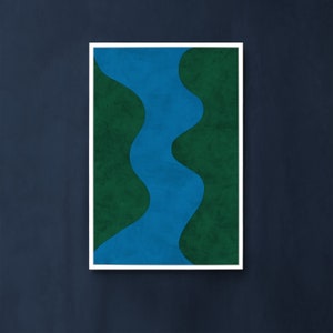 May include: Abstract art print featuring a blue river-like shape winding through a green landscape. The print is framed in a white frame.