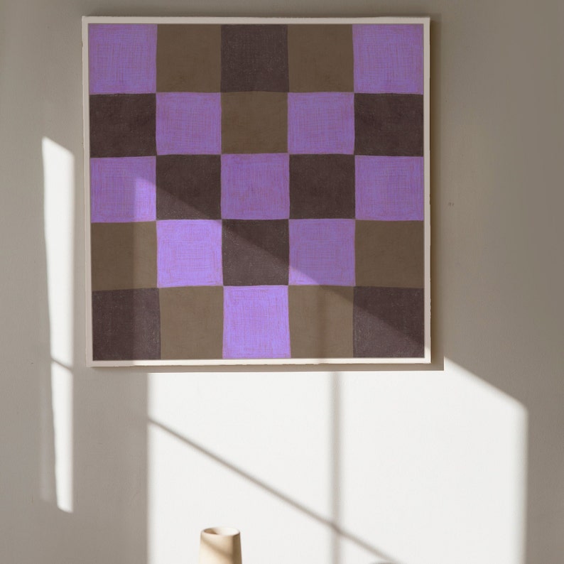 May include: A framed abstract painting with a checkered pattern in shades of purple and brown.