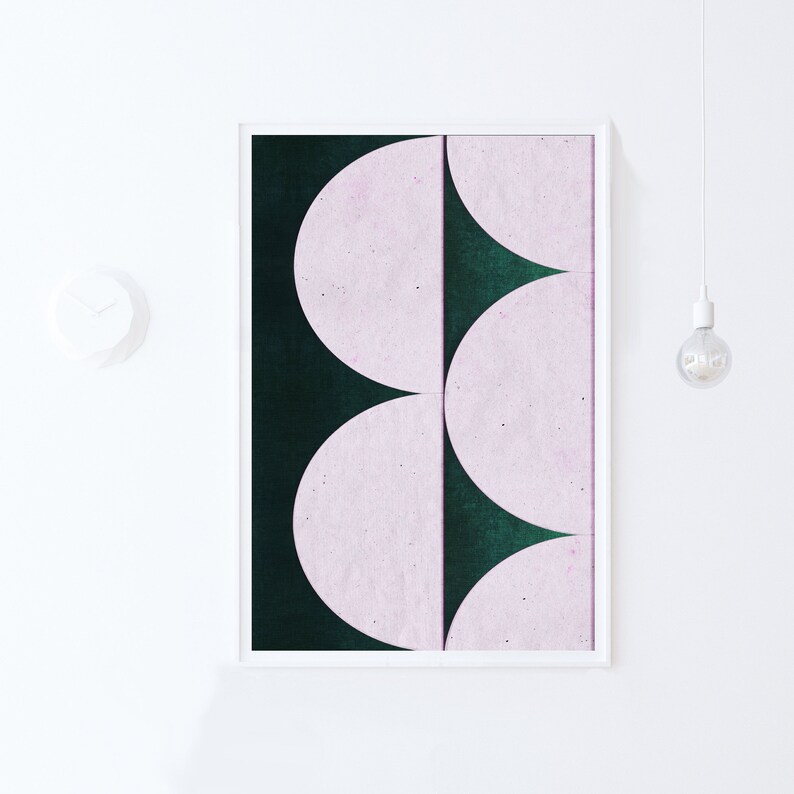 May include: A framed abstract art print with a green background and three pink semi-circles.