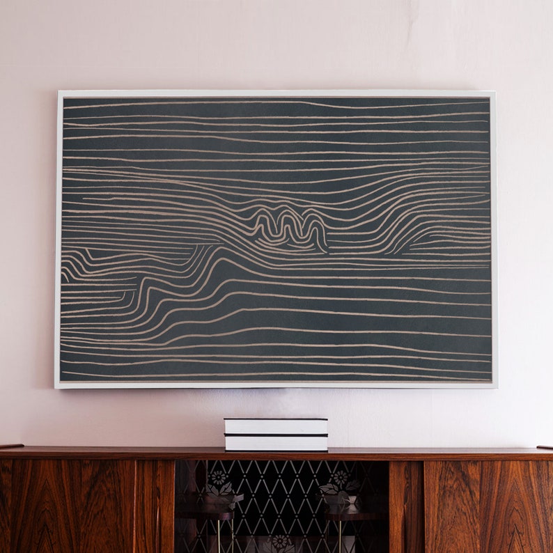 May include: A framed abstract art print with a black background and white lines creating a wavy pattern.