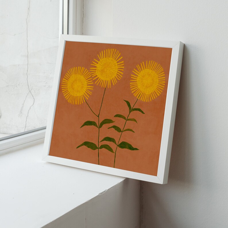 May include: A framed print of three yellow flowers with green stems on a brown background.