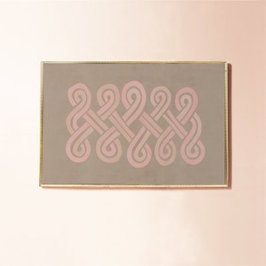 K&ouml;nnte beinhalten: Ein gerahmter abstrakter Kunstdruck mit einem geometrischen Design aus ineinandergreifenden Formen in Rosa und Braun.