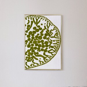 May include: A framed abstract art print featuring a green and white design. The design resembles a stylized tree or plant with a circular shape.