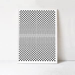 May include: Framed black and white abstract art print. The artwork features a pattern of black dots that create an optical illusion of depth and perspective. The print is encased in a white frame, suitable for modern home decor.