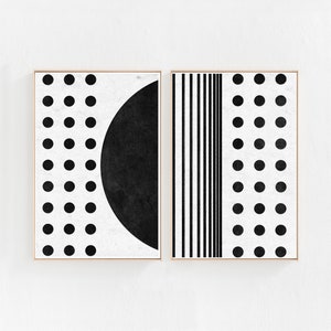 Puede incluir: Dos impresiones de arte abstracto en blanco y negro con formas geom&eacute;tricas. La impresi&oacute;n de la izquierda presenta un c&iacute;rculo negro sobre un fondo blanco con puntos negros. La impresi&oacute;n de la derecha presenta rayas verticales negras sobre un fondo blanco con puntos negros.