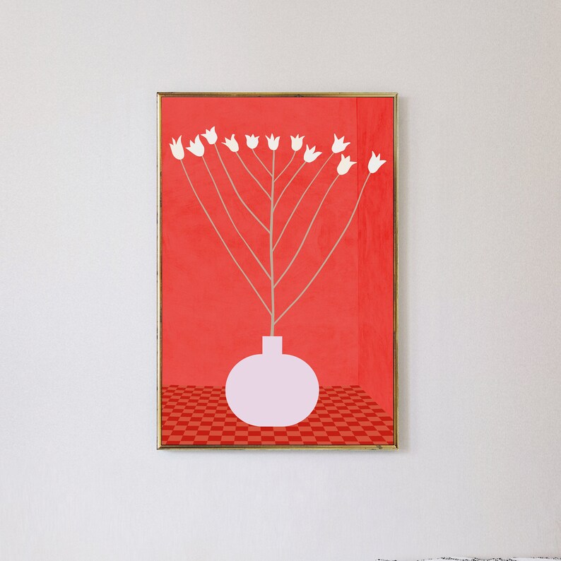 May include: A framed print of a white flower arrangement in a pink vase against a red background with a checkered pattern at the bottom.