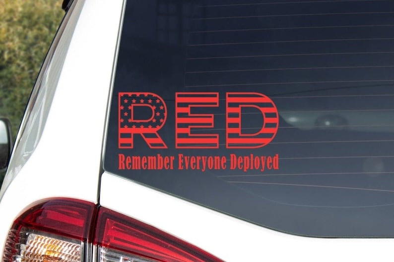 May include: Red, white, and blue car decal with the letters "RED" in large font and the words "Remember Everyone Deployed" in smaller font below.