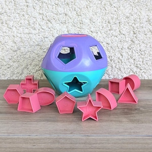 jouet TUPPERWARE vintage 1990-2000 Shappe-O, jeu éducatif de formes a trier et encastrer, violet, turquoise, rose, ballon, balle, boule