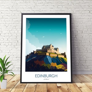 May include: A framed illustration of Edinburgh Castle in Scotland. The castle is depicted on a hill with a blue sky and white clouds in the background. The text "EDINBURGH" and "Scotland" is printed below the image.
