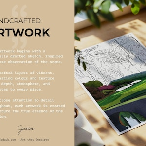 May include: A landscape artwork featuring a bridge, trees, and green fields. The artwork is on a white paper, with the text "HANDCRAFTED ARTWORK" and other descriptive text. The artwork is displayed on a wooden surface.