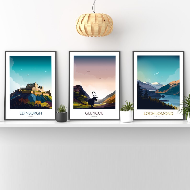May include: Three framed prints of Scottish landscapes. The first print features Edinburgh Castle, the second print features a stag in Glencoe, and the third print features Loch Lomond.