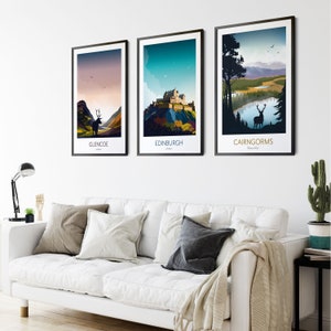 May include: Three framed prints of Scottish landscapes. The first print shows a silhouette of a deer in a mountainous landscape with a lake. The second print shows a castle on a hill with a blue sky and white clouds. The third print shows a mountain range with a lake in the foreground. The prints are all in a minimalist style with bold colors and simple lines.