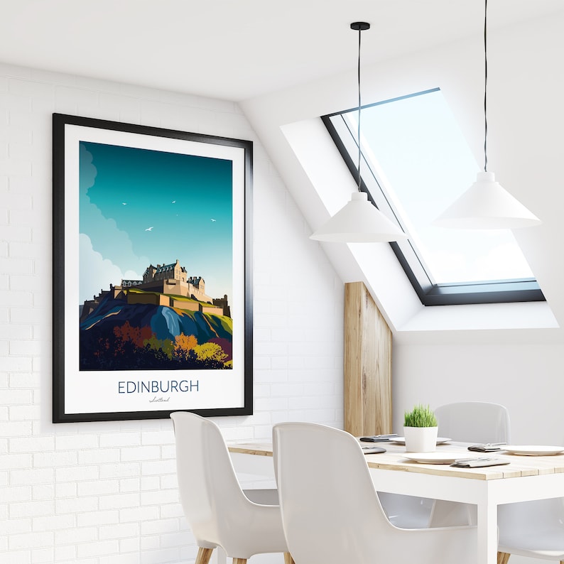 May include: A framed print of a stylized illustration of Edinburgh Castle in Scotland. The print has a blue sky with white clouds and a few birds flying in the sky. The text "EDINBURGH" and "Scotland" is printed below the image.