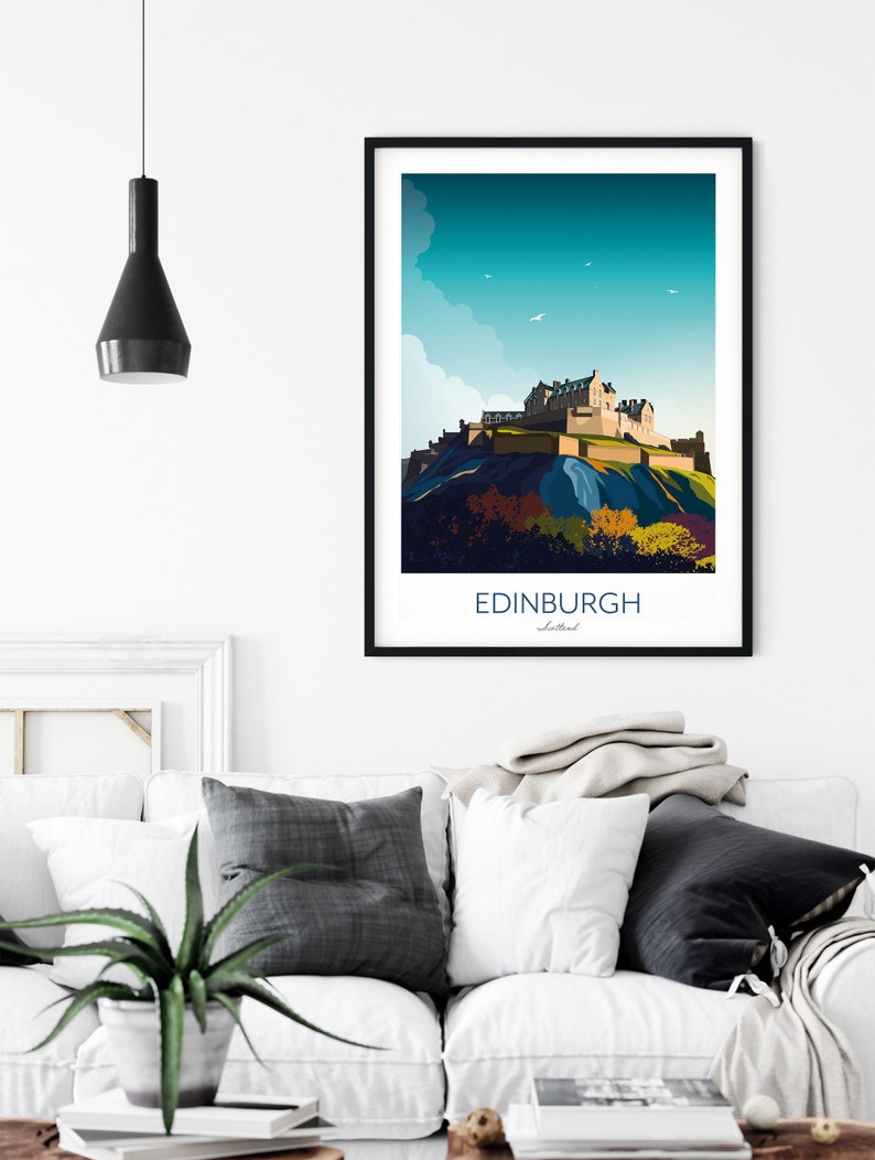 May include: A colorful illustration of Edinburgh Castle, a historic fortress in Scotland, with a blue sky and white clouds in the background. The text "EDINBURGH" is printed below the image.
