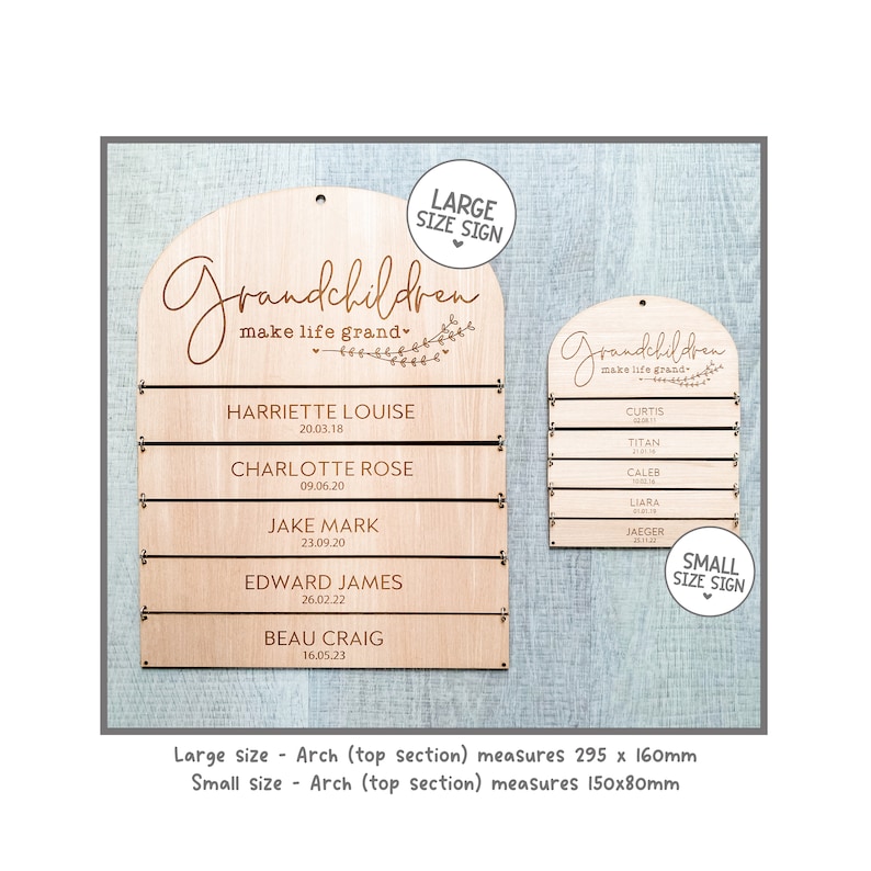 May include: Wooden sign with the word "Grandchildren" in script, with space for names and dates. The sign has an arched top and includes the text "make life grand." The large sign measures 295 x 160mm, and the small sign measures 150x80mm.