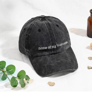 None of My Business Dad Hat – Funny Adjustable Baseball Cap, Custom Embroidery Available, Personalized Gift, Unstructured Hat, Humor