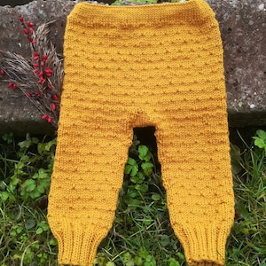 Hand knitted pants for babies, toddler and children. Merino wool leggings, trousers for girls, boys. Kids warm merino wool leggings