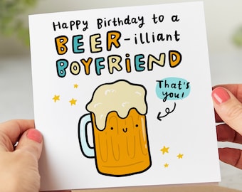 May include: Happy birthday to a beer-illiant boyfriend card with a cartoon beer mug with a smiley face and the text "That's you!" in a speech bubble.