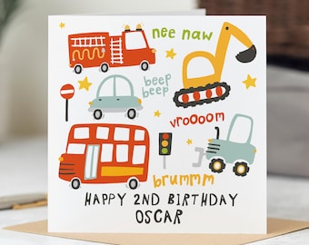 May include: A white greeting card with colorful illustrations of vehicles, including a fire truck, car, bus, excavator, and tractor. Text reads "Happy 2nd Birthday Oscar" with sound effects like "nee naw" and "vroooom".