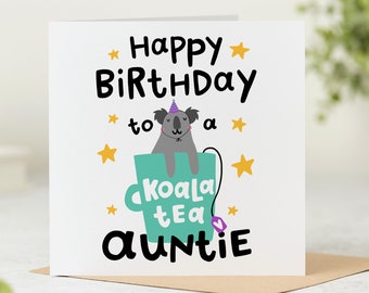 May include: A white card with a happy birthday message to a koala tea auntie. The card features a cartoon koala wearing a party hat sitting in a teal teacup with a purple tea bag.