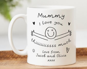 May include: White ceramic mug with a black handwritten message that reads "Mummy I love you this much love from Jacob and Olivia XXXX" with a simple drawing of a person with arms outstretched.