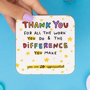 May include: A white coaster with yellow stars and the text "THANK YOU FOR ALL THE WORK YOU DO & THE DIFFERENCE YOU MAKE you are SO appreciated".