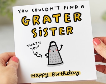 May include: A white card with a yellow and black illustration of a grater with a face and the text "You couldn't find a grater sister. That's you!" and "Happy Birthday".